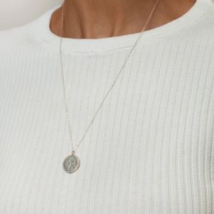 Wolf Circus rose coin necklace in sterling silver.